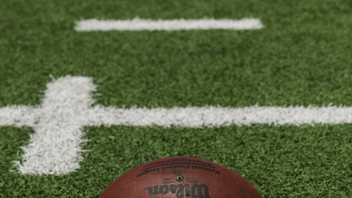 Football on a field before a game.