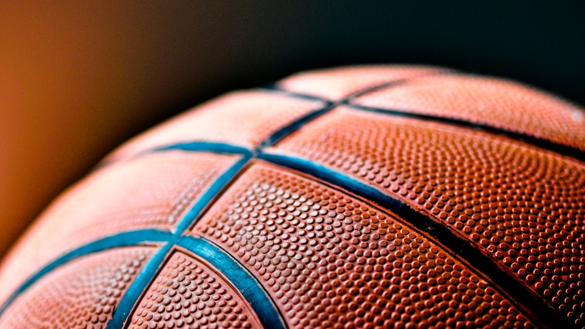 Close-up basketball texture for sports ball inflation guidance.