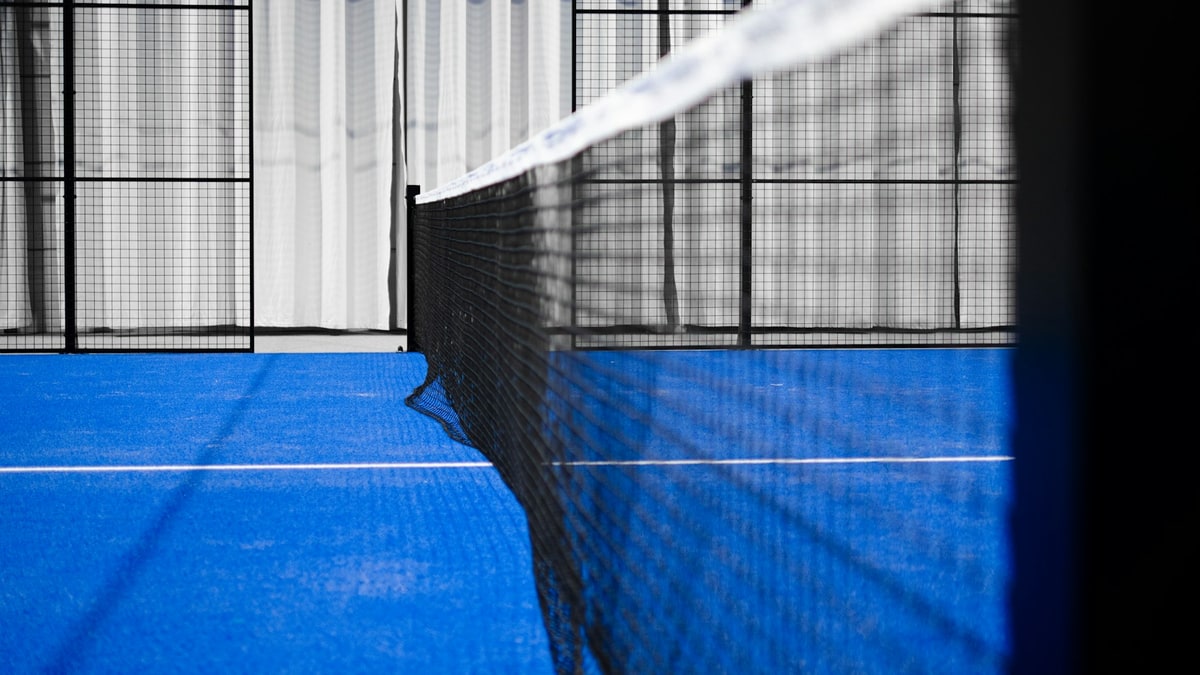 Volleyball on an indoor court before a match.